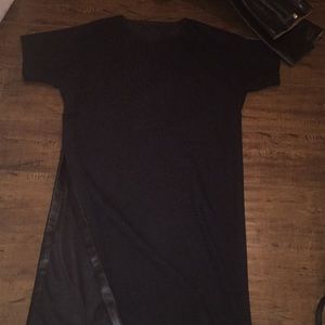 Black cocktail dress with very high side slit.